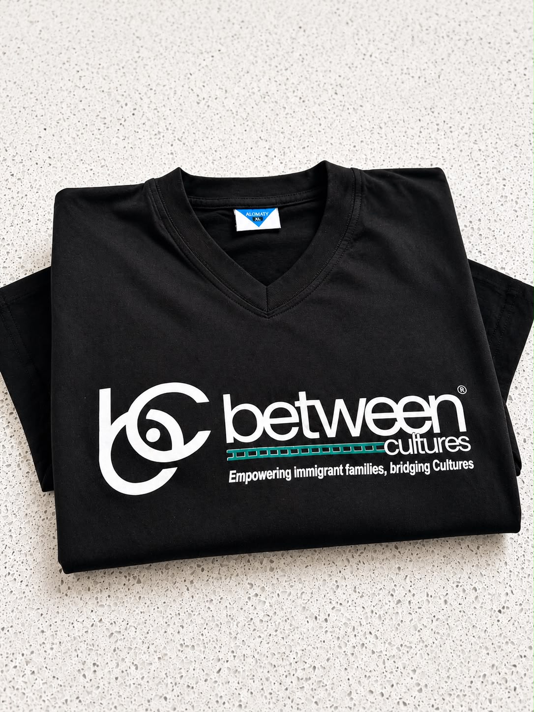 Black V-neck T-shirt.